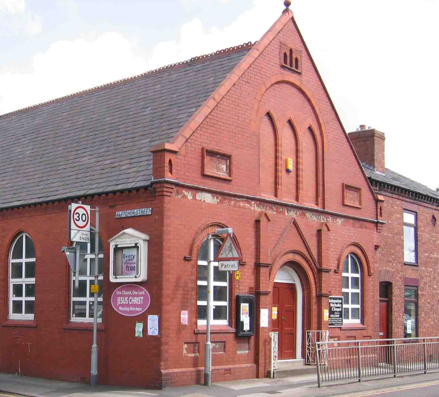 Atherton Independent Methodist Chapel on the corner of Mealhouse Lane and Fletcher Street. Note the inset plaques beneath the front windows. Photo by Peter Wood, July 2005