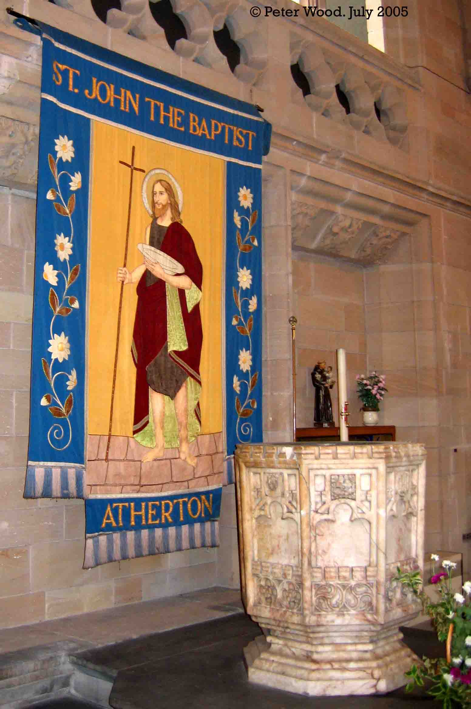 St John the Baptist, Atherton, banner behind the font