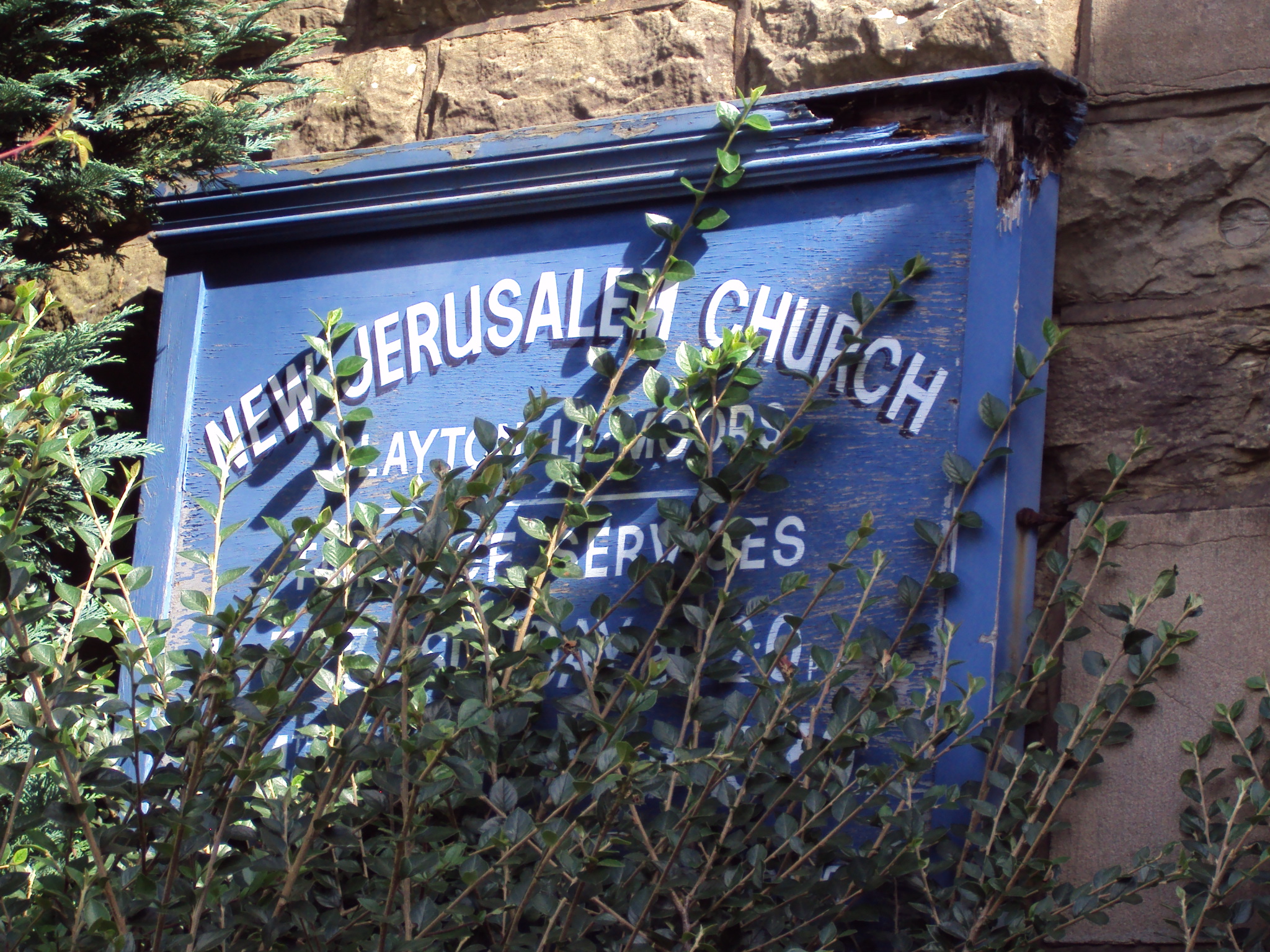 The rather overgrown Church sign