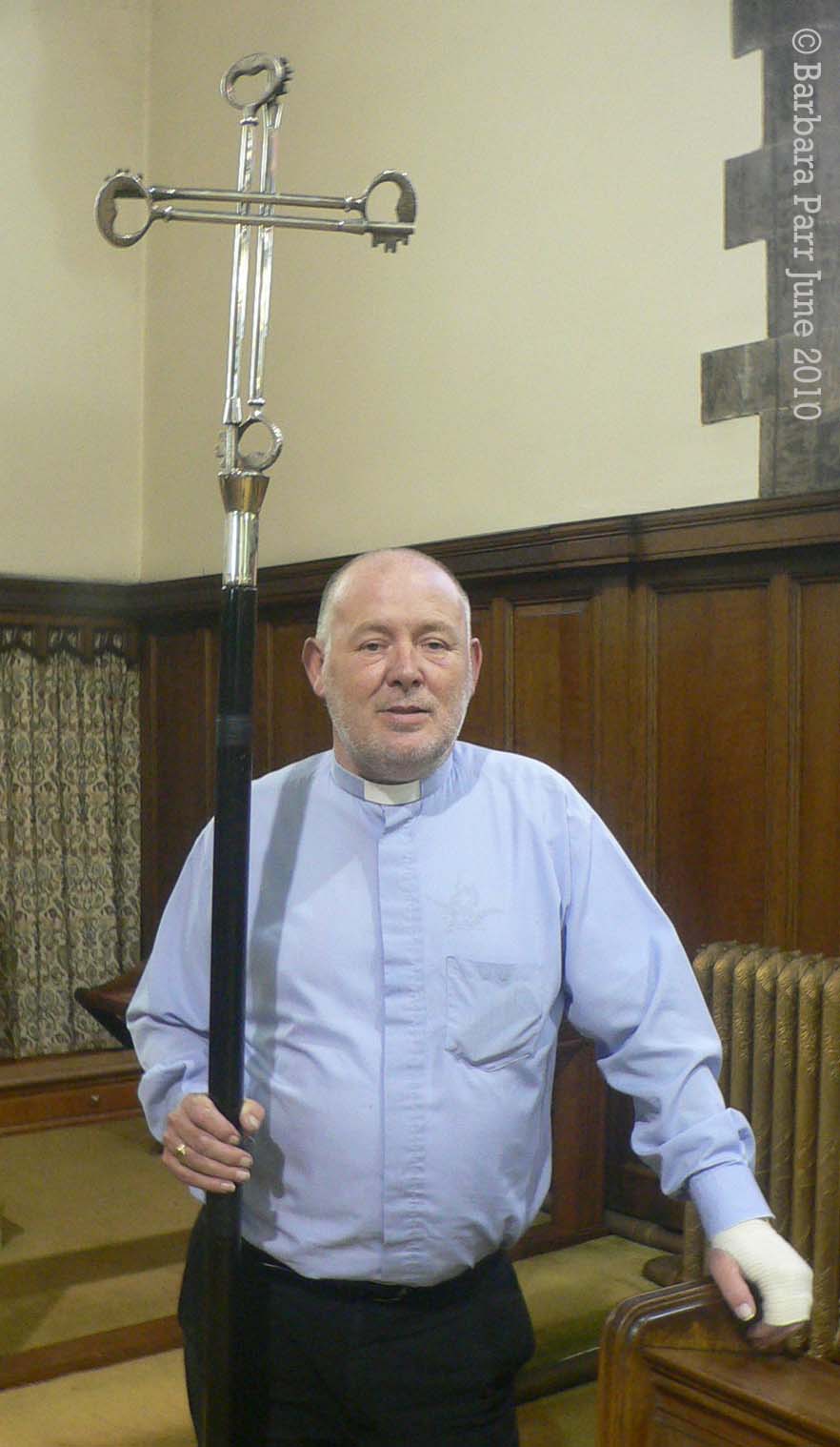 The late Revd. Stephen Mather (Vicar 1999-2013) holding a cross representing St Peter's keys