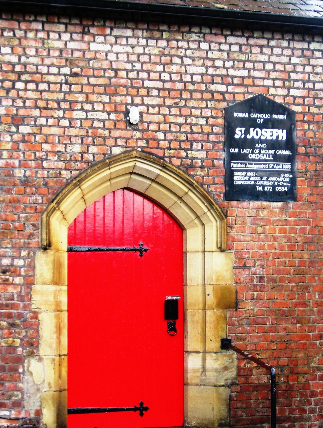 Door to the church with church board