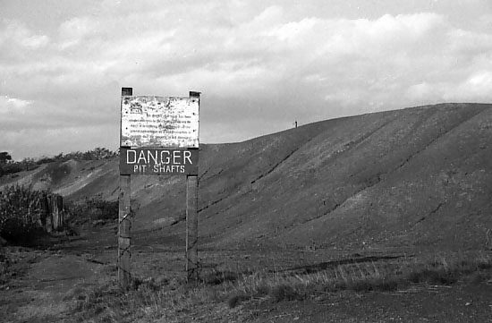 The SW edge of the 'Little Rucks' at Pretoria. The colliery made sure to dump its waste only in Westhoughton - the boundary with Atherton was the fence line at the base of the heap. Photo by Peter Wood, September 1962