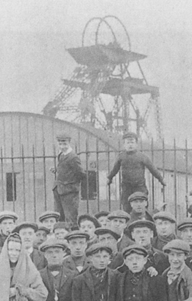 Members of the Hindsford mining community on Tyldesley Road in 1912. The downcast Chanters No.1 headgear forms a backdrop. Photo by courtesy of Alan Davies