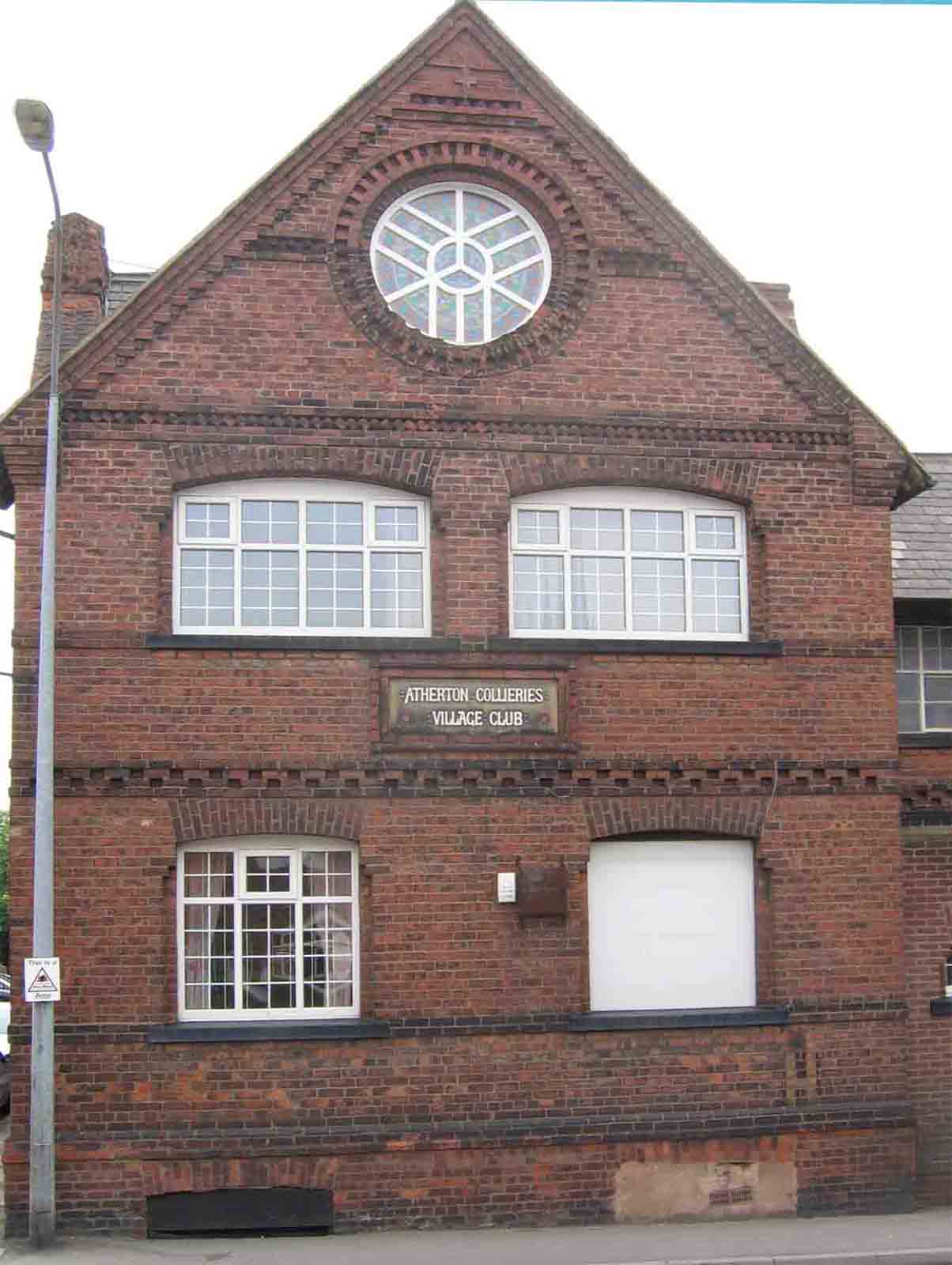 Atherton Collieries Village Club on Leigh Road. That sign is one of only 3 obvious reminders that Atherton was once an important coal mining town. Photo by Peter Wood, May 2005