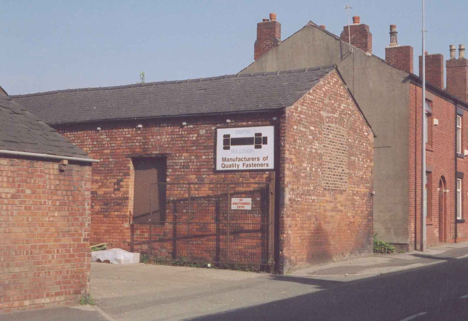 The High Street entry to Smith Bullough Fasteners, the last of the Atherton iron bolt makers; a good example of mid-late Victorian urban architecture. Photo by Peter Wood, 15 Aug 2003
