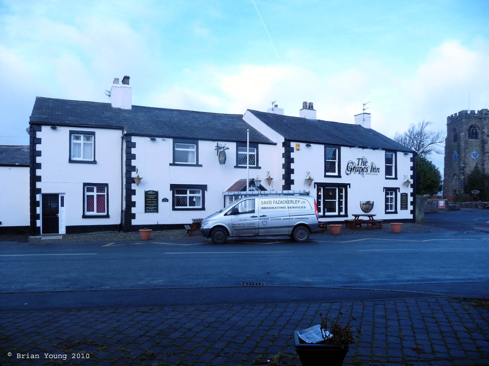 The Grapes with the church in the background, Goosnargh. Photograph supplied by and  of Brian Young
